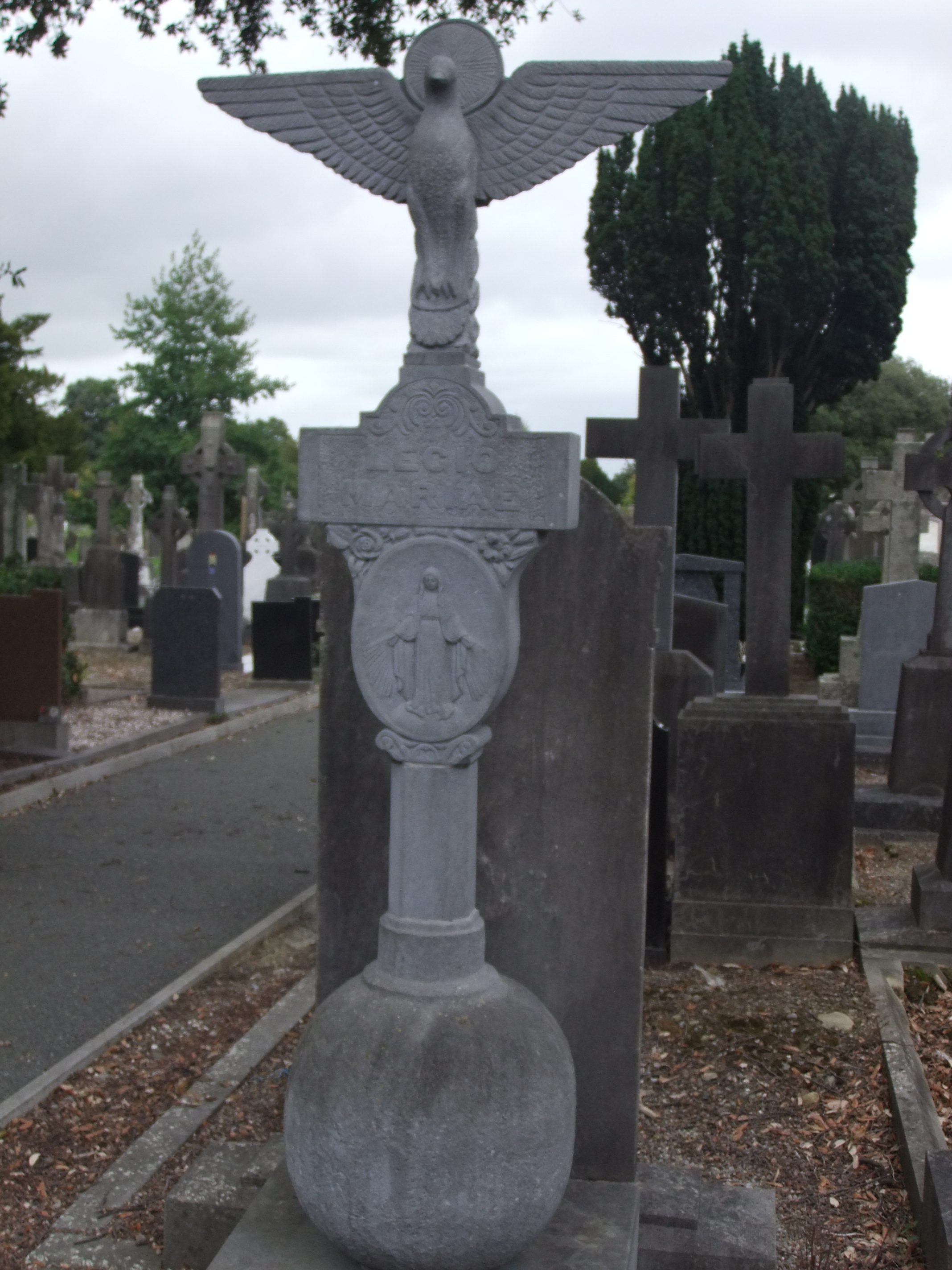 Legion of Mary memorial, Glasnevin Cemetery, with a carved dove and relief of the Virgin Mary, by Albert Power